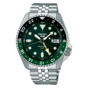 A stainless steel Seiko automatic GMT wristwatch with a dark green dial, luminous markers, rotating numbered bezel, and date window, shown on black.